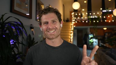 Matt Palmer smiling and giving a peace sign in a talking-head video frame