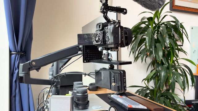The camera and the monitor sharing one arm, seen from the window side